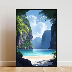 May include: A colourful illustration of Maya Bay in Thailand. The image shows a tropical beach with turquoise water, lush green cliffs, and palm trees. The text "MAYA BAY THAILAND" is printed in white at the top of the image.