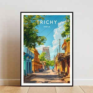May include: A colourful illustration of a street scene in Trichy, India. The street is lined with yellow buildings and green trees. A tall, ornate temple is visible in the distance.
