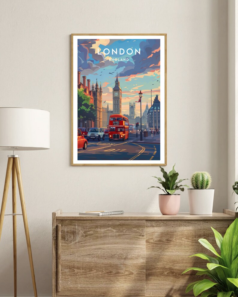 May include: A vintage-style travel poster featuring a red double-decker bus driving down a street in London, England. Big Ben is visible in the background. The poster has the text "LONDON ENGLAND" at the top.