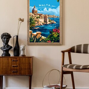 May include: A vintage travel poster featuring a colorful illustration of a cityscape with a large domed building overlooking a blue body of water. The poster has the text "MALTA MEDITTERANEAN" at the top.