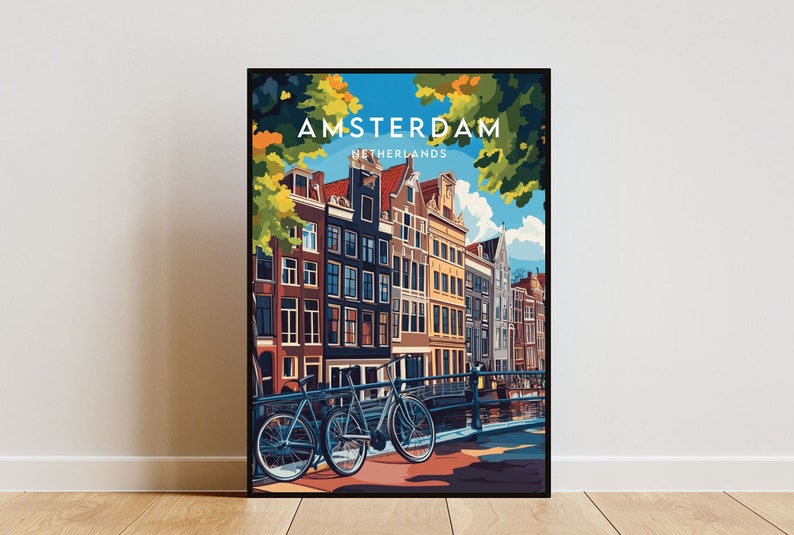 May include: A colorful illustration of Amsterdam, Netherlands, with a view of traditional canal houses and two bicycles parked on a bridge. The text "AMSTERDAM" and "NETHERLANDS" is displayed in white letters on a blue background.