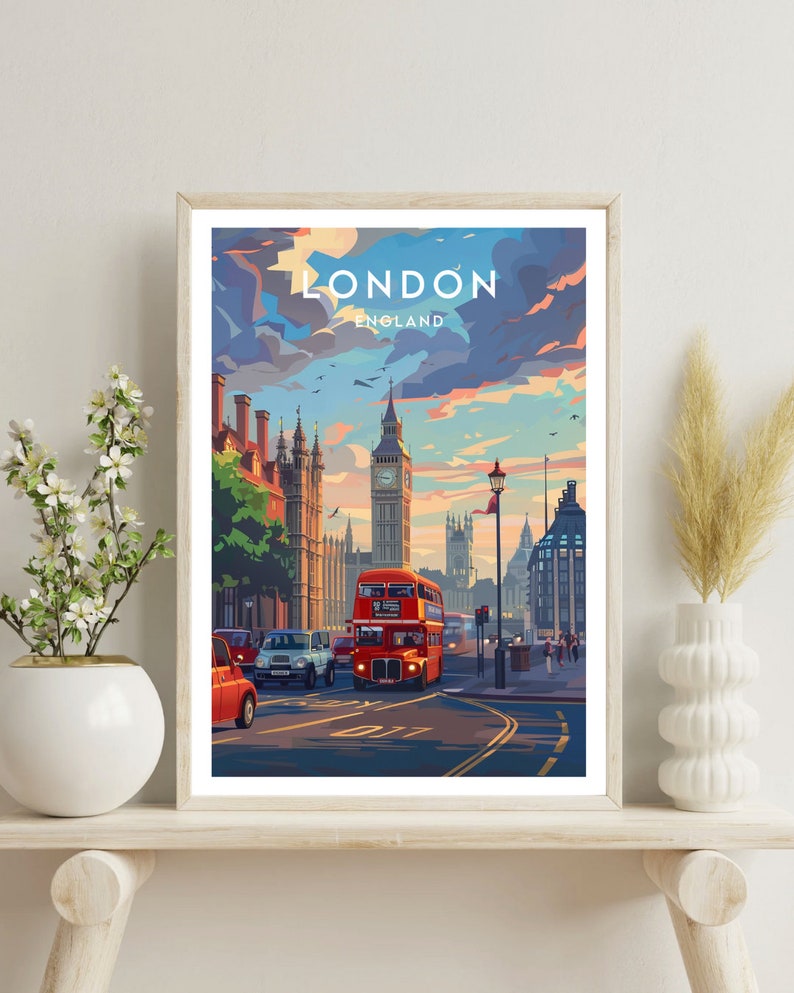 May include: A vintage-style travel poster featuring a red double-decker bus driving down a street in London, England. Big Ben is visible in the background. The poster has the text "LONDON ENGLAND" at the top.