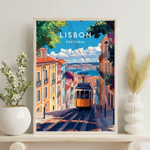 May include: A vintage travel poster featuring a yellow tram traveling up a steep hill in Lisbon, Portugal. The poster has a blue sky with white clouds and colorful buildings on either side of the tram.