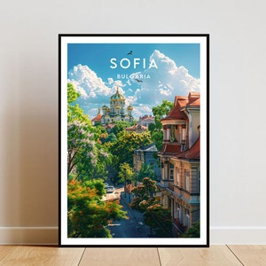 May include: Framed art print featuring a scenic view of Sofia, Bulgaria. The image showcases a cityscape with a prominent church, lush greenery, and buildings with red-tiled roofs under a bright blue sky with fluffy clouds. The word "SOFIA" is displayed at the top.