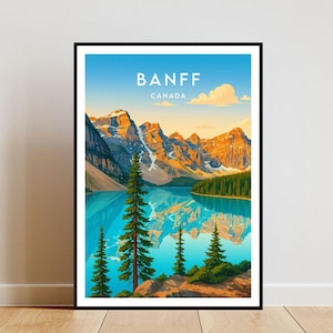 Pode incluir: Impressão artística emoldurada com uma vista de Banff, Canadá. A obra retrata um lago turquesa refletindo montanhas cobertas de neve e árvores perenes sob um céu azul. As palavras "BANFF" e "CANADA" são impressas no topo.