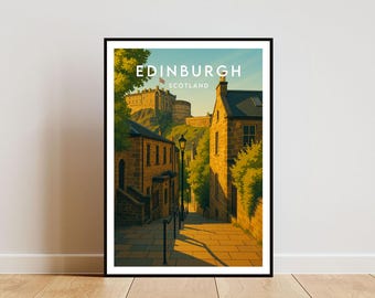 May include: Framed art print of Edinburgh, Scotland. The image depicts a street scene with stone buildings and a castle on a hill. The text "EDINBURGH SCOTLAND" is at the top of the print. The artwork is in a black frame and is displayed on a white wall.