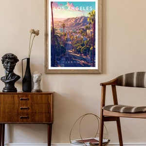May include: A vintage-style poster with a scenic view of Los Angeles, California. The poster features a road lined with palm trees and buildings in the distance. The text "Los Angeles, United States" is printed at the top of the poster.