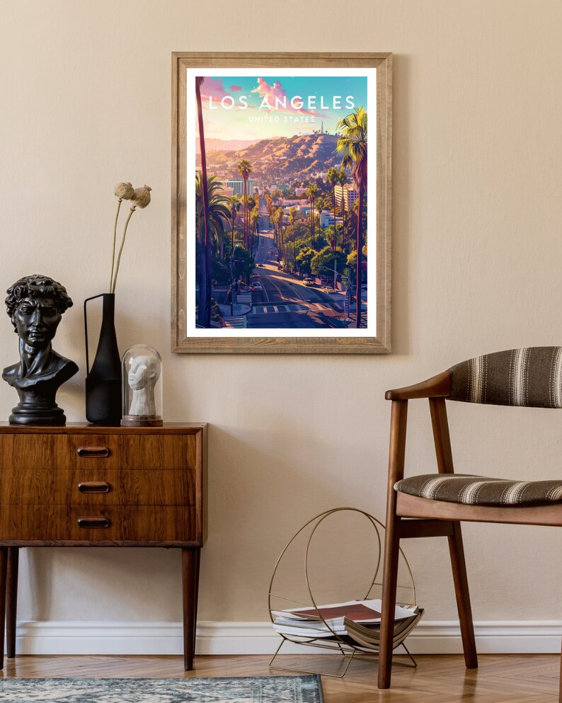 May include: A vintage-style poster with a scenic view of Los Angeles, California. The poster features a road lined with palm trees and buildings in the distance. The text "Los Angeles, United States" is printed at the top of the poster.