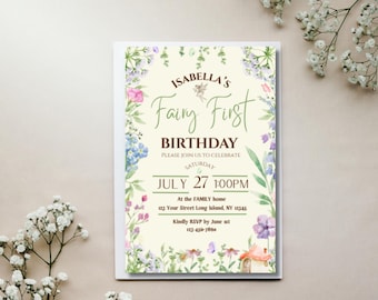 May include: A cream-colored invitation with floral and fairy illustrations. The text reads "Isabella's Fairy First Birthday" with the date July 27 at 1:00 PM. Additional text includes the address and RSVP information. The invitation is surrounded by a white border.