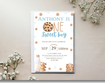 May include: A white invitation card with the text "Anthony is One Sweet Boy" in blue and orange. The card features illustrations of cookies and a milk bottle. The date is September 29th at 1:00 PM. The invitation includes an RSVP date and contact information.