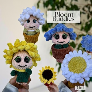 May include: A collection of handmade crochet flower dolls, each with a unique design. The dolls feature smiling faces, vibrant colors, and are presented in small pots. The image includes the text "Bloom Buddies" and "3 in 1".