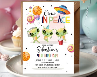 May include: A colorful invitation for a 4th birthday party with a space theme. The invitation features three cartoon aliens, a spaceship, planets, and the text "Come in Peace".