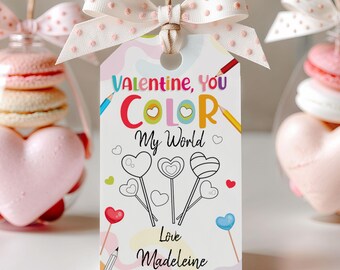 May include: A white Valentine's Day card with a colorful design featuring the text "Valentine, You Color My World". The card has a coloring page of heart-shaped lollipops and the text "Love Madeleine".
