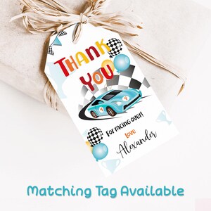 Thank you gift favor tag 2x3.5 inches. A printable, editable, hand drawn blue racing car with colourful flags and balloons with a chequered black and white flag on a white background with colourful letters. Matching invite available.