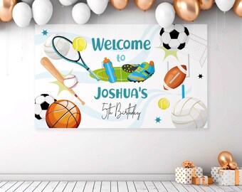 May include: A white banner with a blue and white wave design. The banner features various sports equipment, including a baseball bat, basketball, soccer ball, football, volleyball, tennis racket, and tennis ball. The text on the banner reads "Welcome to Joshua's 5th Birthday".
