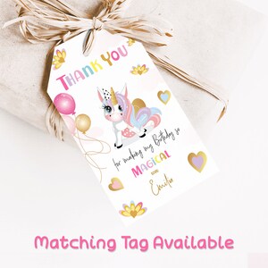 Unicorn thank you gift favor tag 2x3.5 inches. A printable, editable, hand drawn template with a white unicorn and balloons in pretty pastel shades of pink and purple. Perfect for party guests treat bags. Matching invite available.