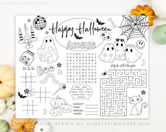 May include: Black and white Halloween-themed activity placemat with the text "Happy Halloween" and the name "Amelie". Includes ghosts, pumpkins, a maze, word search, and tic-tac-toe. Hand-drawn design.