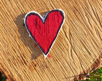 Toppa a forma di cuore rosso