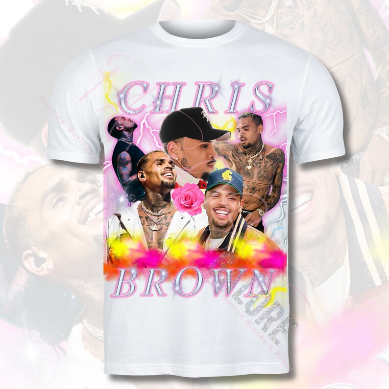 May include: White t-shirt featuring a collage of images of Chris Brown. The images are in a pink, yellow and blue colour scheme. The text "CHRIS BROWN" is printed in pink letters on the shirt.