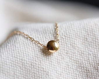 Gold Coin Bead Necklace. 14K gold filled stacking layering necklace. Tiny bead. Simple, Classic minimalist gold necklace. Adjustable length.