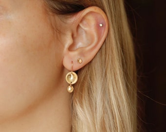 Reflecting Pool Earrings in 14K Gold Filled. Concave dome earrings. Dainty pools of light. Perfect everyday jewelry. Handmade gold earrings.
