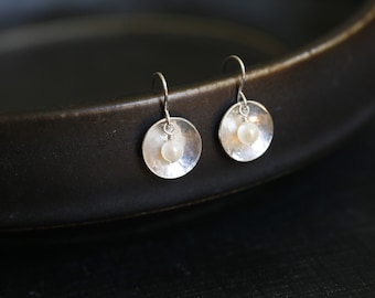 Pearl Cup Earrings. Sterling silver hammered circle and genuine fresh water pearls. Delicate bridal jewelry. White real pearl earrings.