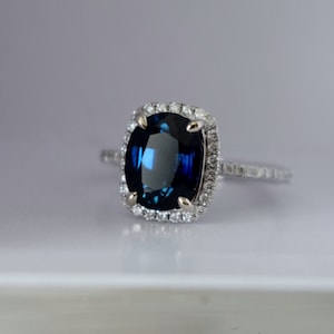 Jet blue sapphire engagement ring. White Gold Engagement Ring 2.7ct Deep Blue Sapphire cushion halo engagement ring 14k white gold.