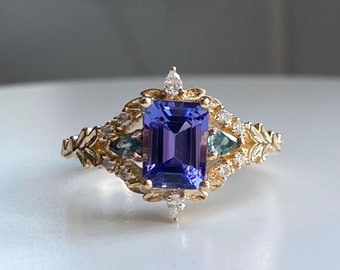 Arwen Tanzanite engagement ring emerald cut. Purple and Teal Fantasy ring 14k Gold engagement ring. Tanzanite, sapphires, and diamonds ring.