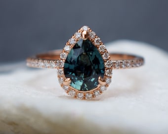 Green sapphire and diamonds pear shaped halo engagement ring in rose gold. Wedding anniversary gift for wife, by Eidelprecious