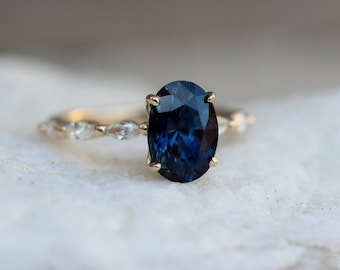 Peacock sapphire ring. Blue green sapphire engagement ring. Peacock blue sapphire oval diamond ring. Godivah ring. Yellow gold ring.