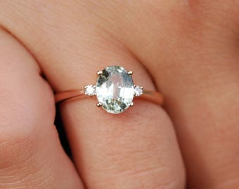 Light green sapphire engagement ring. 3 stone ring. Natural sapphires engagement rings. Sapphire and diamond engagement ring in rose gold.