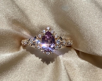 Kassandra Lilac Pear Cut Sapphire engagement ring. Unique Fantasy gold engagement ring with sapphire and diamonds. Delicate intricate ring