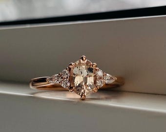 Sandy Sapphire Engagement Ring: Oval Diamond Cluster, Rose Gold