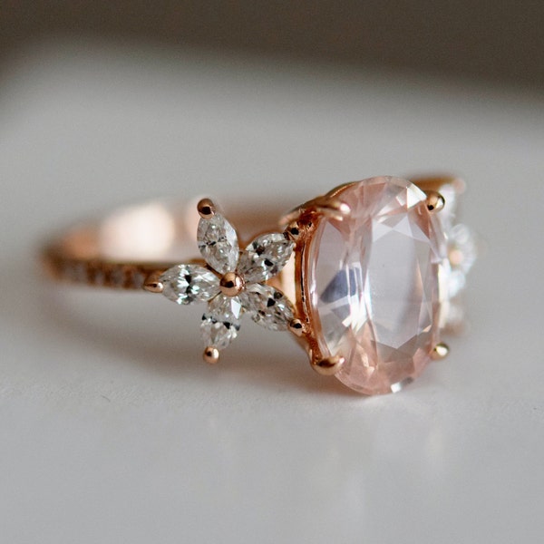 Flower ring engagement ring by Eidelprecious. Oval Peach sapphire diamond ring. Fiji design. 14k rose gold ring.