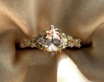 Arwen Natural Peach Sapphire and Diamonds Pear Cut Engagement Ring in 14k Gold. Unique elvish fantasy nature inspired engagement ring.
