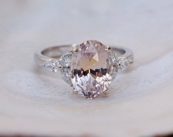 Peach pink sapphire ring. Color change sapphire ring. 4.2ct oval sapphire ring. White gold ring. Trillium Engagement ring