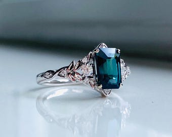 Eowen Teal Sapphire Ring. Radiant cut, deep teal blue natural sapphire, Fantasy Engagement ring, 14k white Gold diamond cluster ring.