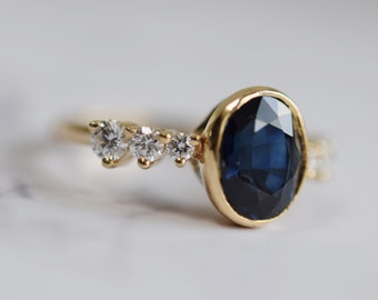 Vintage inspired Bezel blue sapphire ring. Low profile Engagement ring. Deep blue sapphire oval diamond ring. Yellow gold ring.