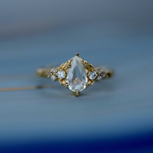 Stella white sapphire ring. Pear shaped engagement ring, sapphire and diamond ring ring in gold. Anniversary gift for wife.