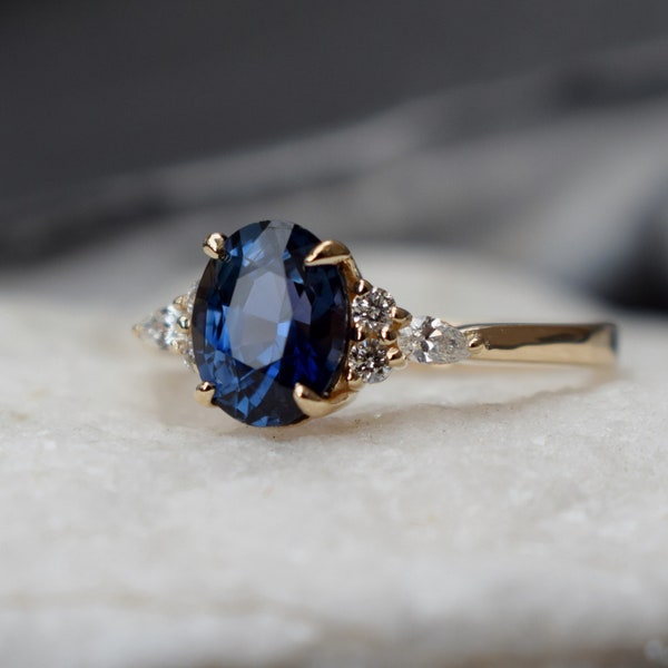 Navy blue sapphire engagement ring. Peacock blue sapphire ring 2.5ct oval diamond ring 14k Yellow gold ring. Campari by  Eidelprecious.