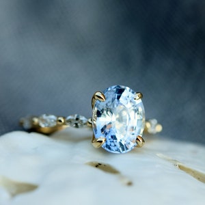 Ice blue sapphire diamond engagement ring, bridal set with oval light blue sapphire and marquise diamonds in 14k yellow gold y Eidelprecious