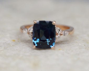 Deep blue sapphire diamond ring in rose gold. Sapphire engagement ring. Blue sapphire ring with diamond clusters. Unique engagement ring