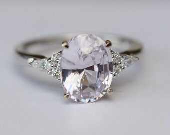 Platinum engagement ring with Lavender sapphire and diamond clusters. Oval light lavender sapphire ring Campari design by Eidelprecious