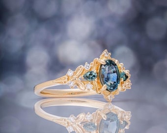 Greta sapphire ring. Teal engagement ring, blue green sapphire ring. Fantasy ring with sapphire and diamonds 14k yellow gold Eidelprecious.