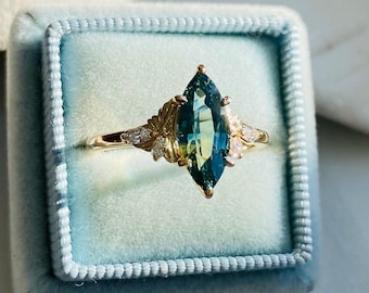 Fiore Beta Parti Teal Marquise Cut Sapphire Engagement Ring: 14k Gold Lab Diamonds Humming Bird Ring
