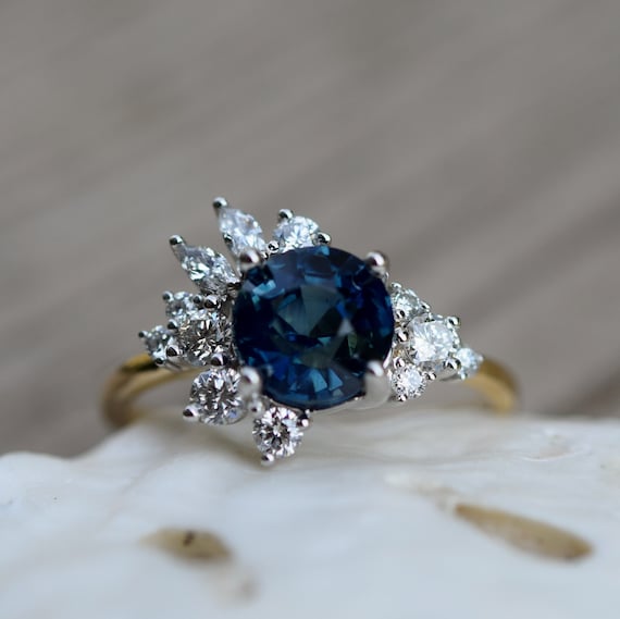 Asymmetrical Diamond Cluster Ring. Unique Deep Blue Sapphire
