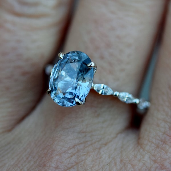 Oval Blue Grey Sapphire and Diamond Engagement Ring in white gold. Elegant classic engagement ring for alternative bride