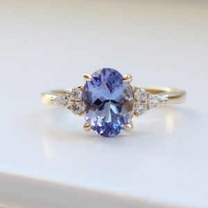 Periwinkle Tanzanite ring in 14k Yellow Gold. Cluster Engagement ring and bridal set. Lavender Ring by Eidelprecious.