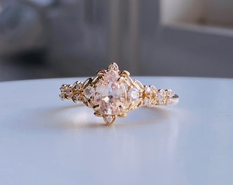 Arwen Peach elvish fairytale pear cut sapphire and diamonds engagement ring in gold. Unique fantasy nature inspired engagement ring.