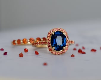 Fall Palette Fantasy ring. 2022 orange and blue Sapphire ring. Orange Sapphire band. 14k yellow gold engagement ring set by Eidelprecious.